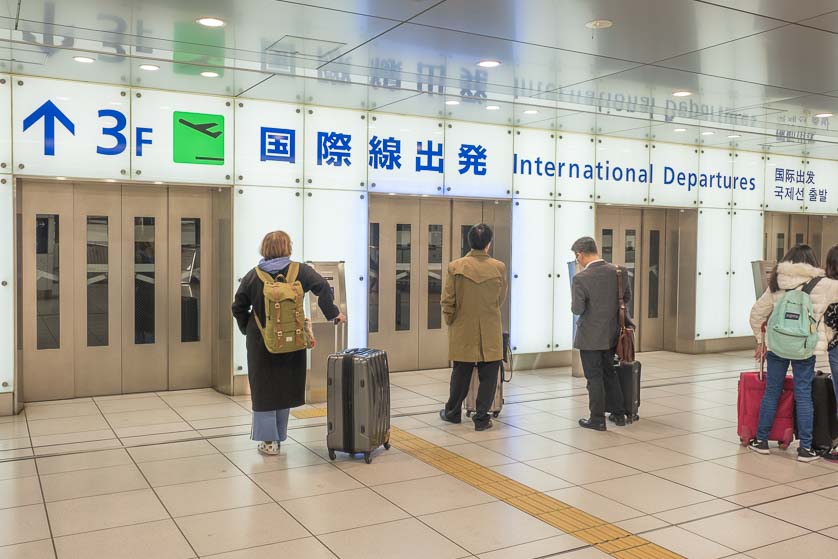 Elevators from railway station floor to departure floor of Narita Airport.