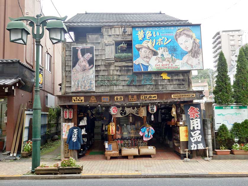 Japanese festival goods store with vintage movie billboard, Ome, Tokyo.