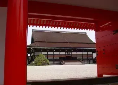 Looking through red gates to the main hall at Kyoto Imperial Palace