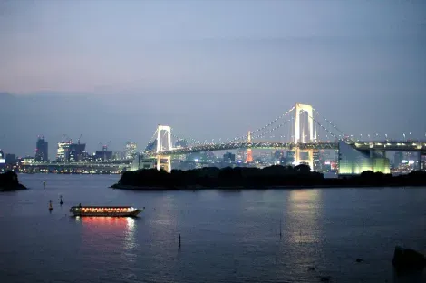 Yakatabune a barge drifting quietly in Tokyo Bay, to the Rainbow Bridge.