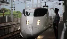 Shinkansen arriving at a station.