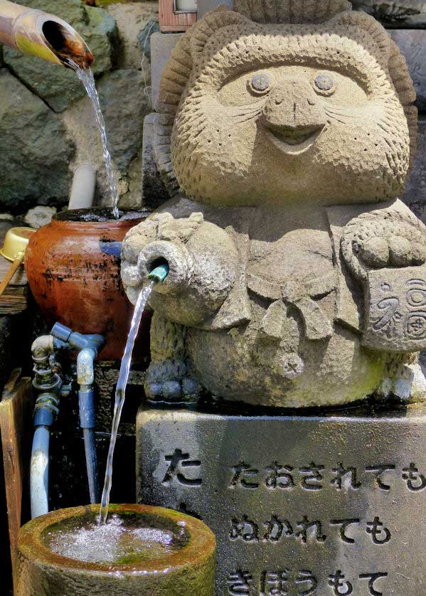 A statue of a tanuki at Kawai no Jizu Spring, one of many natural springs on Chiburijima.