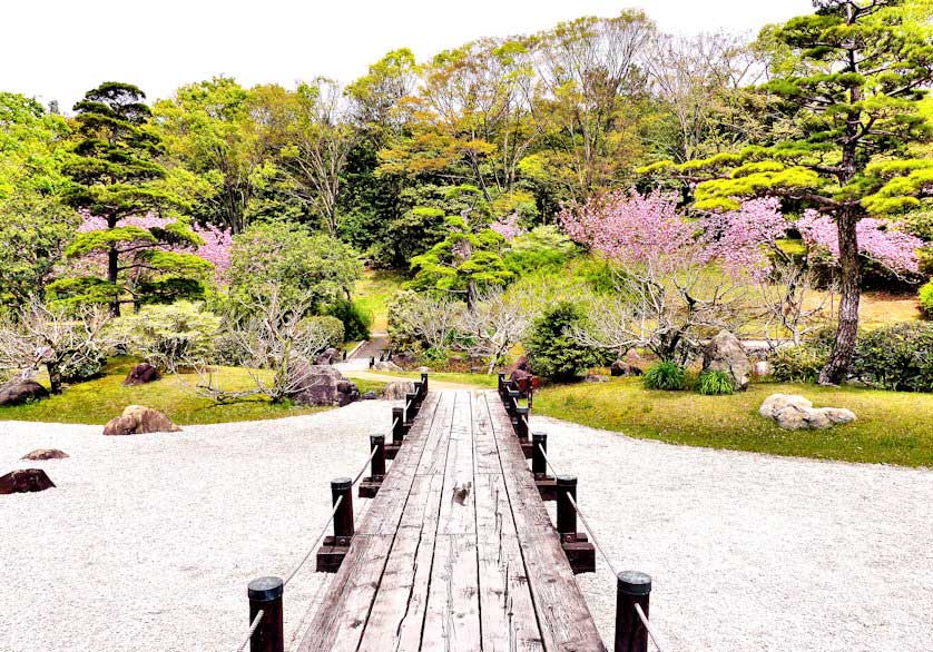 Bridge over the karesansui garden at the Japanese garden in Expo Park, Osaka