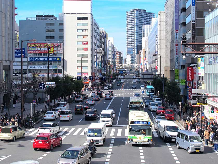 Osaka buses in traffic in Umeda.