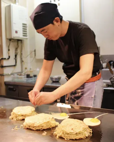 Preparing Hiroshima-style Okonomiyaki 
