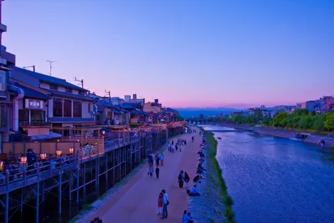 The stroll along the Kamo River in Kyoto can be done on foot or by bicycle.